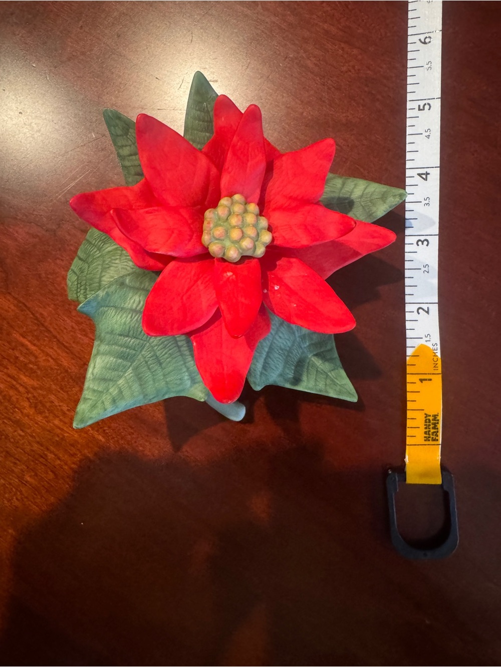 Porcelain figurine titled 'Poinsettia' from Lenox Garden Flower Collection